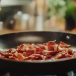 Crispy beef bacon in a skillet.